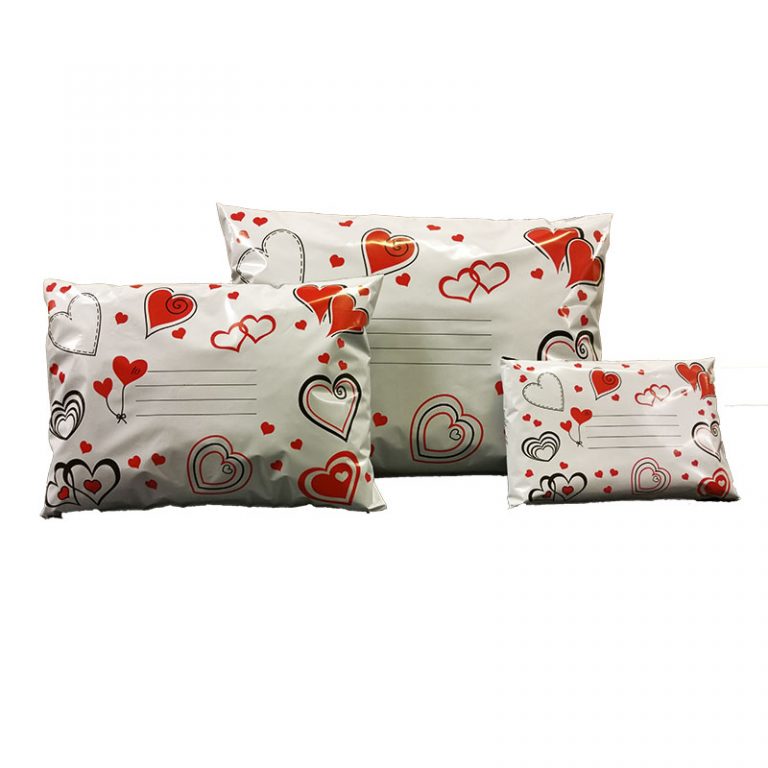 Printed Mailing Bag , white background with red / black hearts outlined all over the bag.