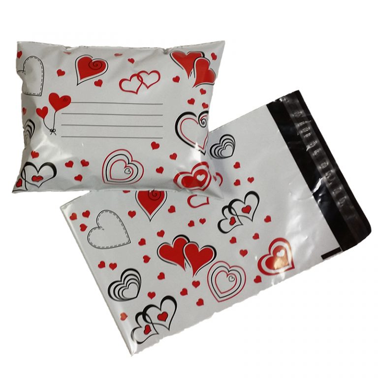 A front and back photo of the small sized printed mailing bag hearts. The hearts in red with some having black outlines