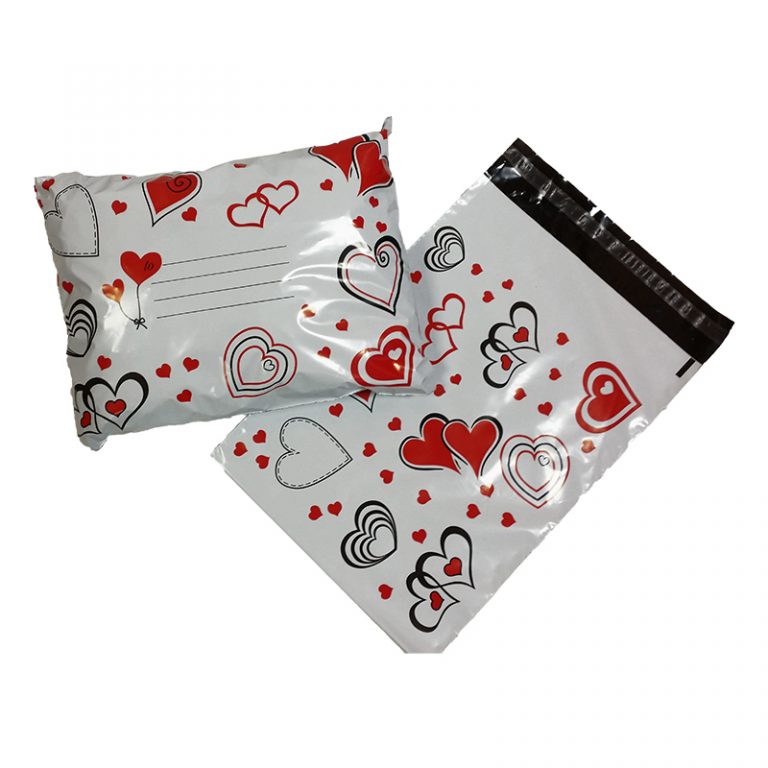 A front & back shot of the medium size printed mailing bag hearts. The hearts are filled red some have black outlines